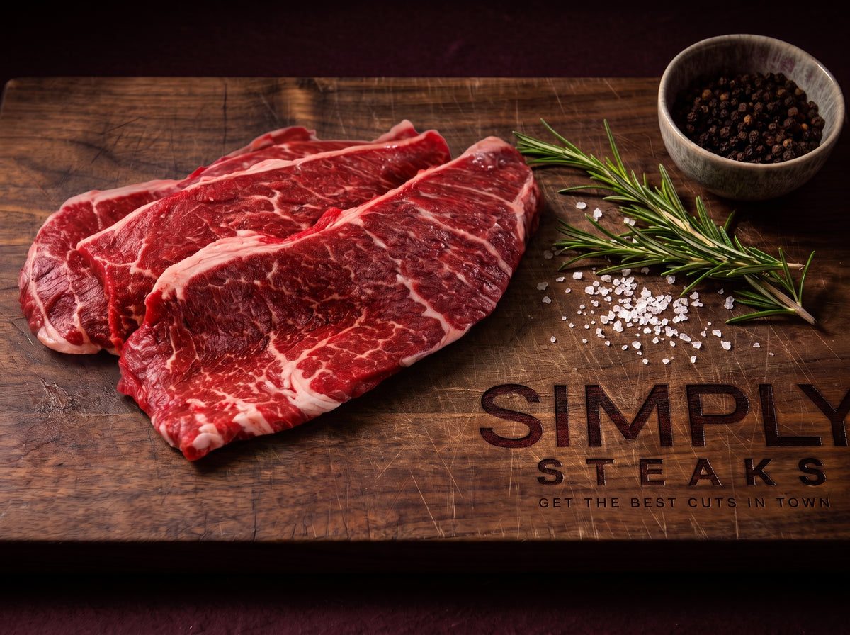 Thin minute steaks on a Simply Steaks wooden board