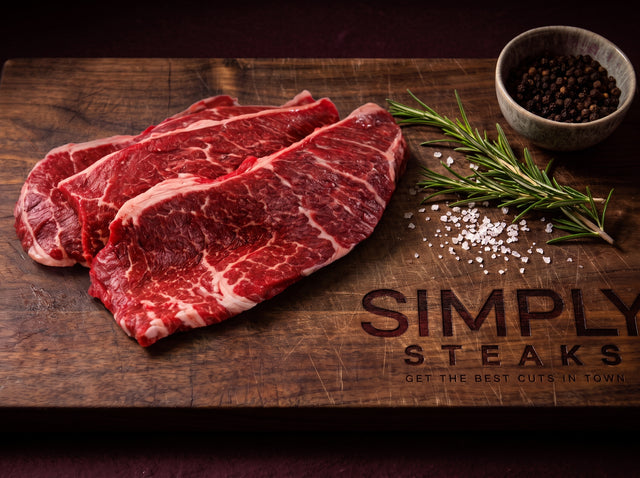 Thin minute steaks on a Simply Steaks wooden board