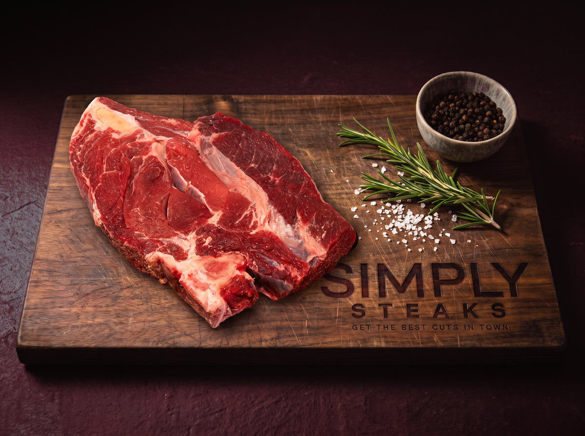 Beef chuck roast joint on a Simply Steaks wooden board