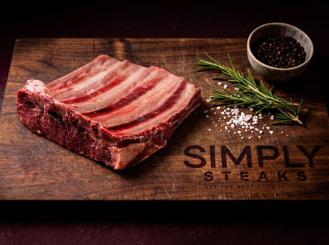 Rack of beef short ribs on a Simply Steaks wooden board