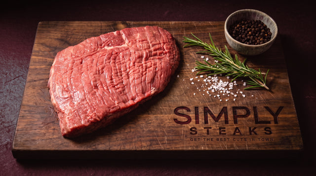 Raw rump steak on a Simply Steaks wooden board