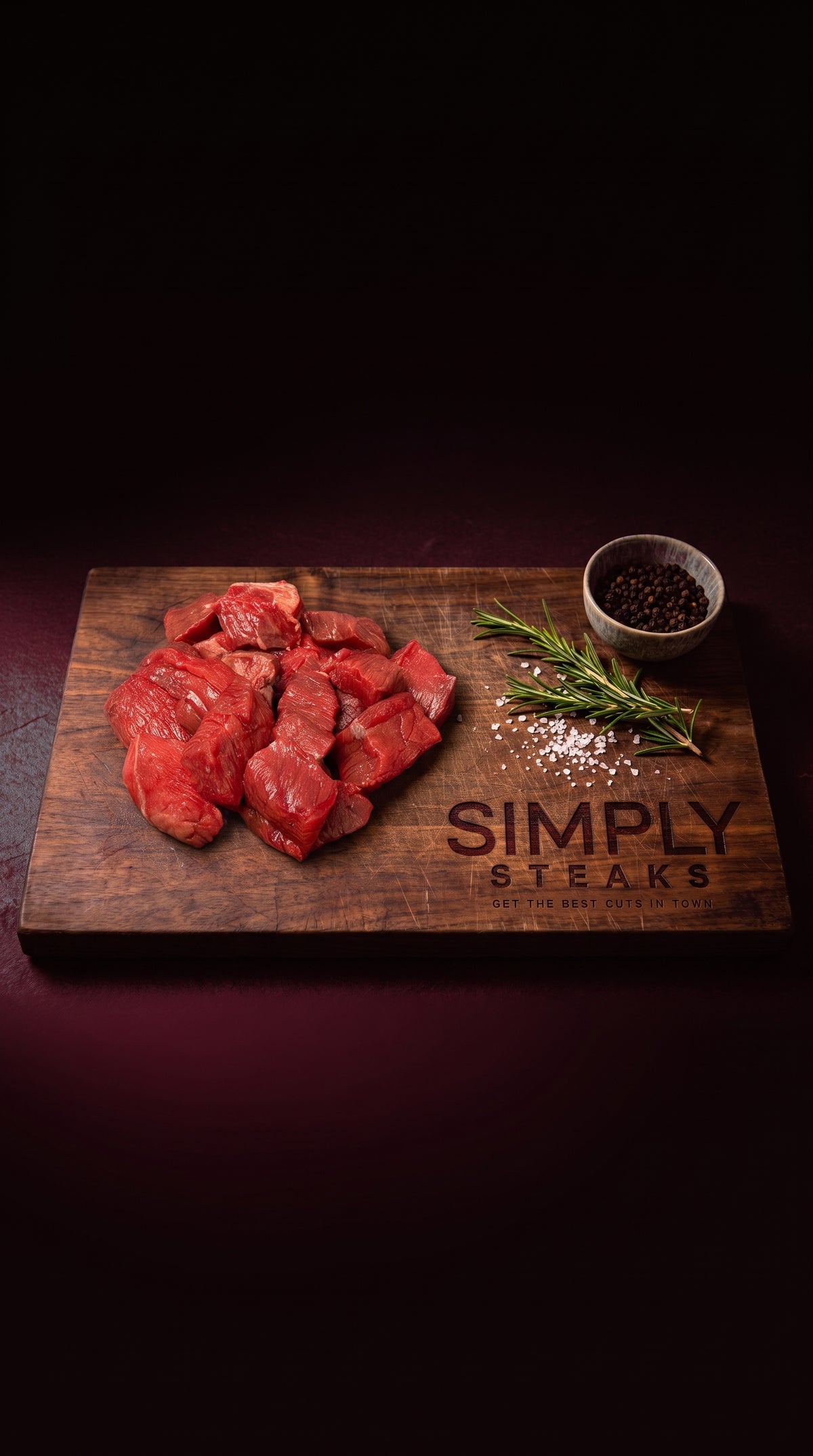Diced boneless beef on a Simply Steaks wooden board